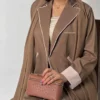 woman wearing brown abaya and shela