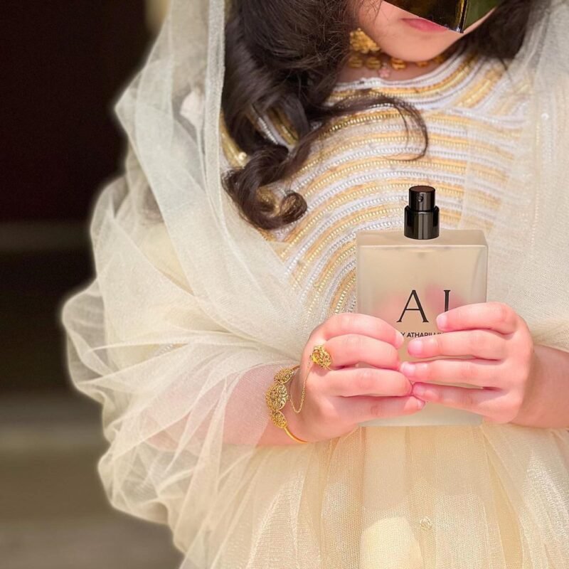 girl holding AJ perfumes from atharii line store