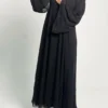 woman wearing abaya with beads