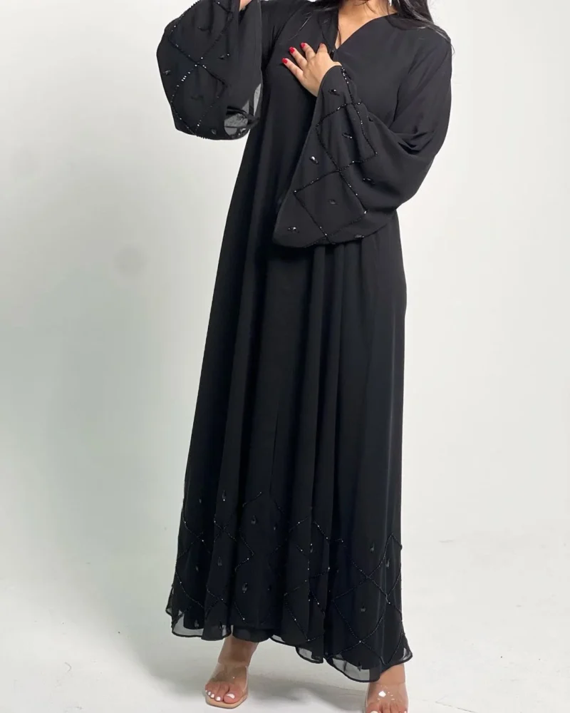woman wearing abaya with beads