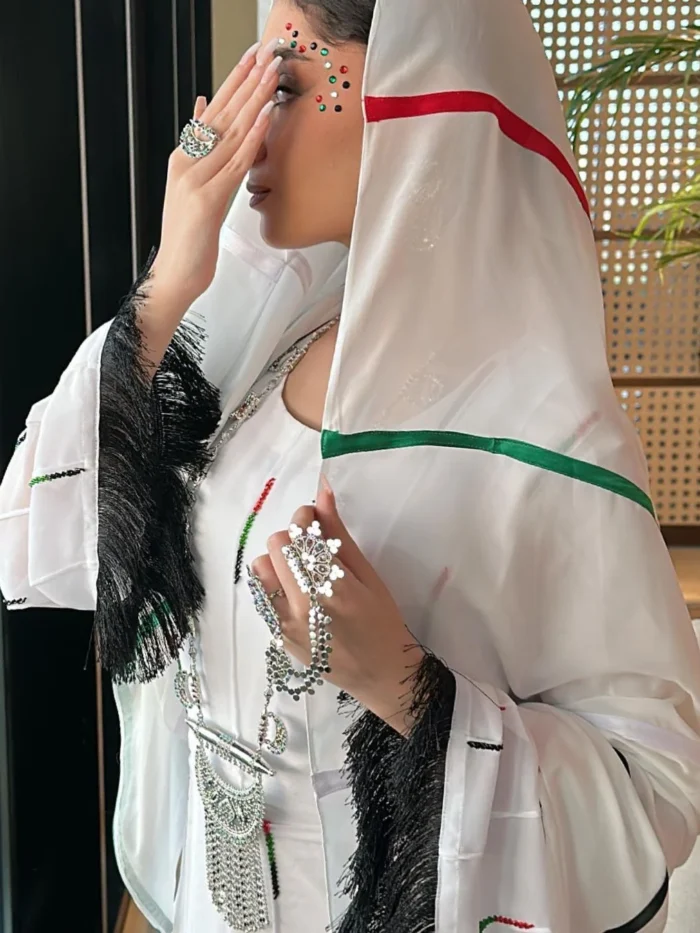 woman wearing uae flag shela